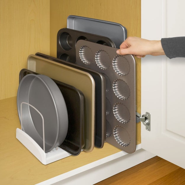 An adjustable bakeware rack that'll make all your flat baking items super-easy to access and store — so you can stop storing them in the oven already.