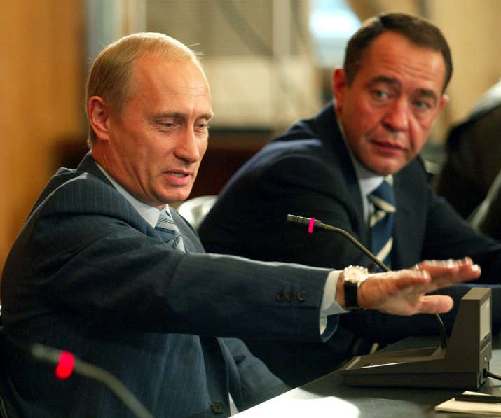 Russian President Vladimir Putin with Lesin in 2002.