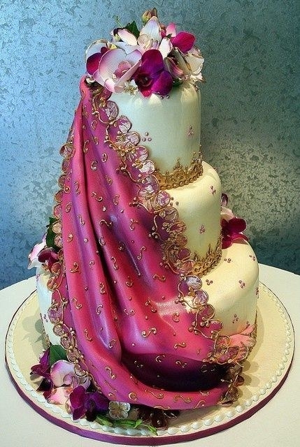 Give the generic wedding cake a twist by draping the cake with an edible saree. You can match the edible draped saree with that of the bride's outfit and surprise her with a matching cake.