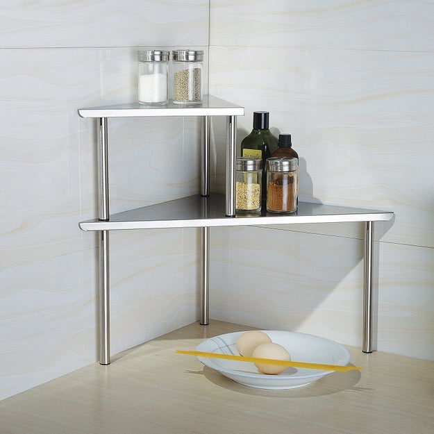 A no-tools-needed two-tier shelf that'll teach any awkward corners a lesson or two about space maximization. (What, your shelves don't talk sternly to your corners?)