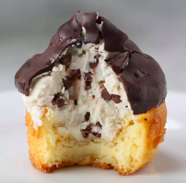 Chocolate-dipped Cannoli Cupcakes — a total masterpiece you can *also* make in a muffin tin for a sweet treat that could be less messy than an OG cannoli.