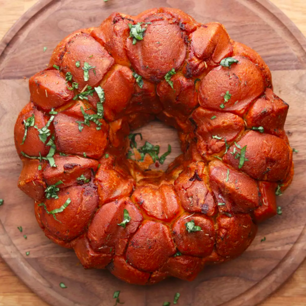 Cheesy Bacon Monkey Bread — a savory winner your friends will definitely be able to tell you baked in a bundt cake pan but they'll still lose their dang minds over.