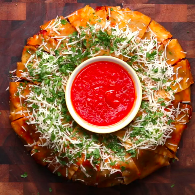 A Lasagna Party Ring that'll have folks asking if you can host every last game watch from now 'til eternity. But you don't *have* to tell them that it turned out so nicely because you made this one in a bundt cake pan, too. 🤐