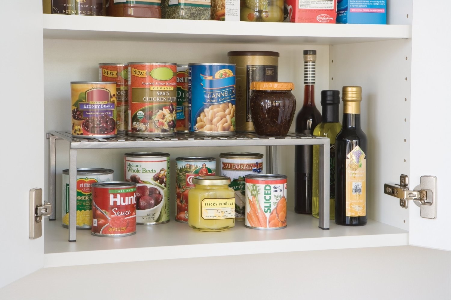 Promising review: "These expandable shelves are the bomb. They are a great size (measure your cabinets carefully if you plan to use them inside). They are extremely sturdy and the expandable feature is so handy. I have four of these of these: three are used for dishes and one in my pantry. This shelf doubles the storage area for canned goods and is a great addition to any cabinet. I am a Fiestaware collector and I have no concern that these sturdy shelves will hold my heavy dishes. If you need to expand your storage, get these. You won't be sorry." —Amazon Fan Price: $14.99