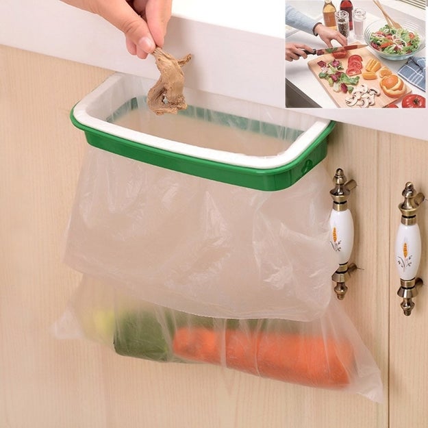 A hanging trash bag holder that'll attach to the outside of your cabinets for easy disposal as you chop and cook. It's like the garbage bowl idea for disposing scraps and trimmings as you go, but even EASIER.