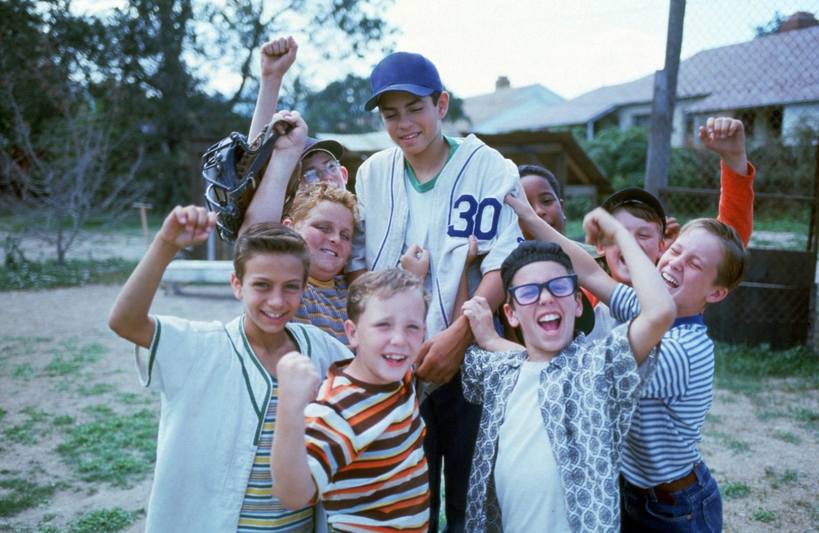 A promotional photo &quot;The Sandlot&quot; cast on a baseball field. 