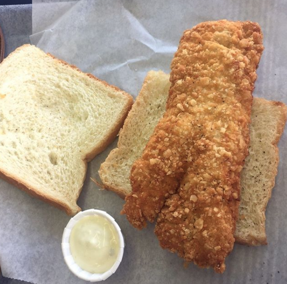 Close-up of the breaded whale-shaped sandwich on toast