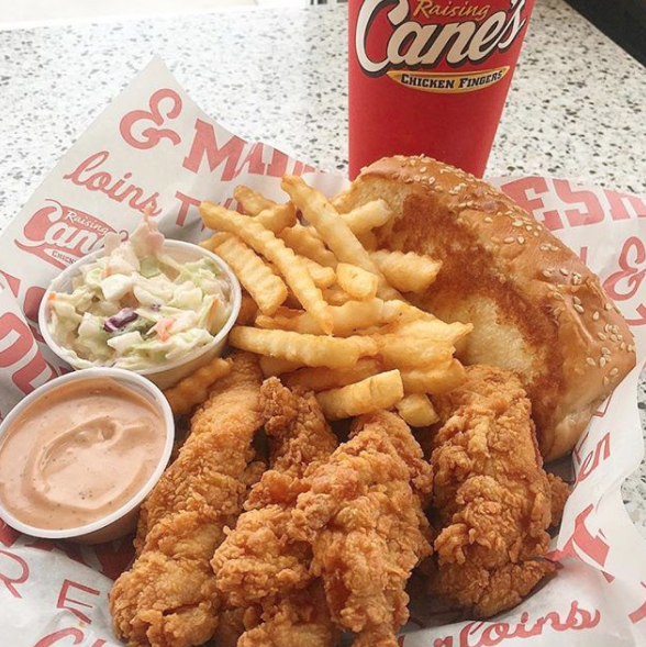 Close-up of chicken tenders, fries, and cole slaw
