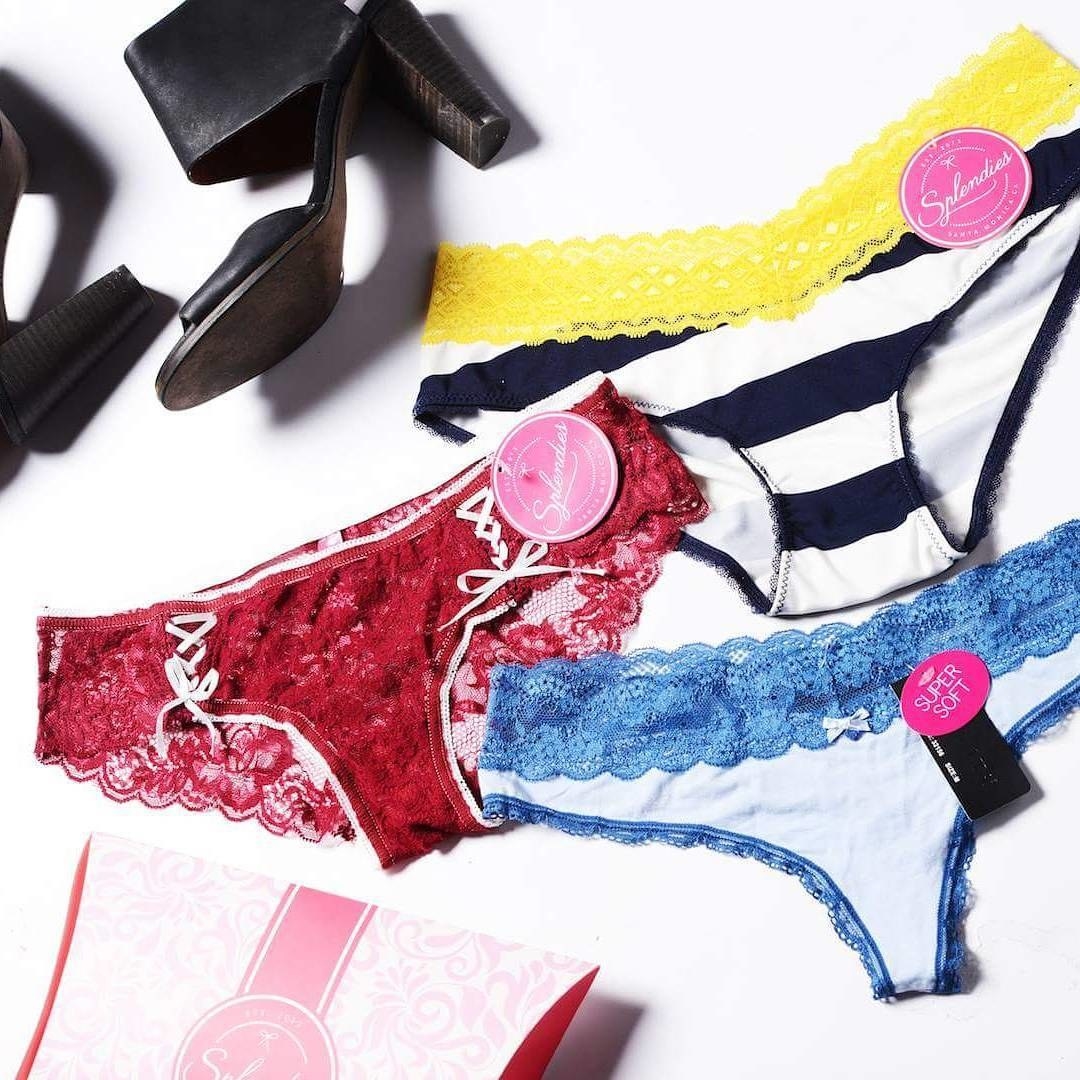 A flatlay of three pairs of undies, all with lace trim