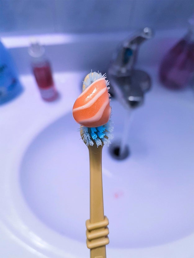 This dab of toothpaste that looks like a little piece of salmon.