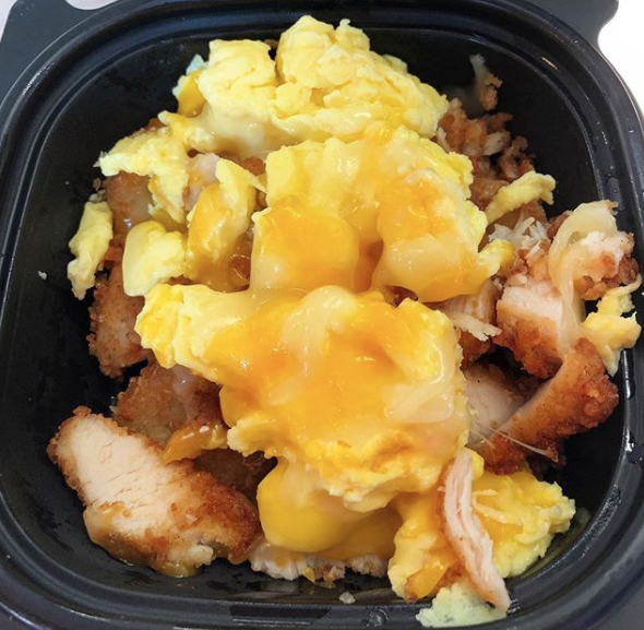 Close-up of hash browns and scrambled eggs