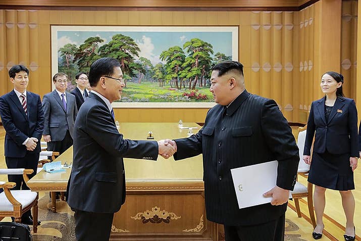 Chung Eui-yong (left), head of South Korea's presidential National Security Office, shakes hands with Kim Jong Un at their meeting in North Korea.