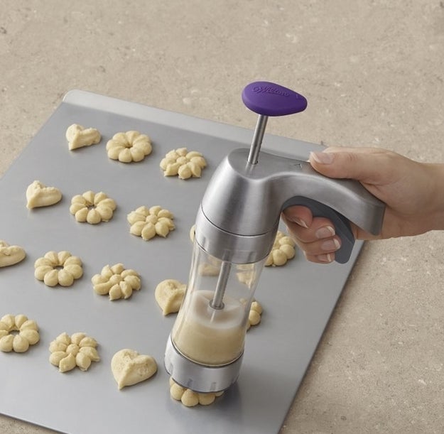 A cookie press with 12 discs to prepare cookies in a variety of fun shapes.