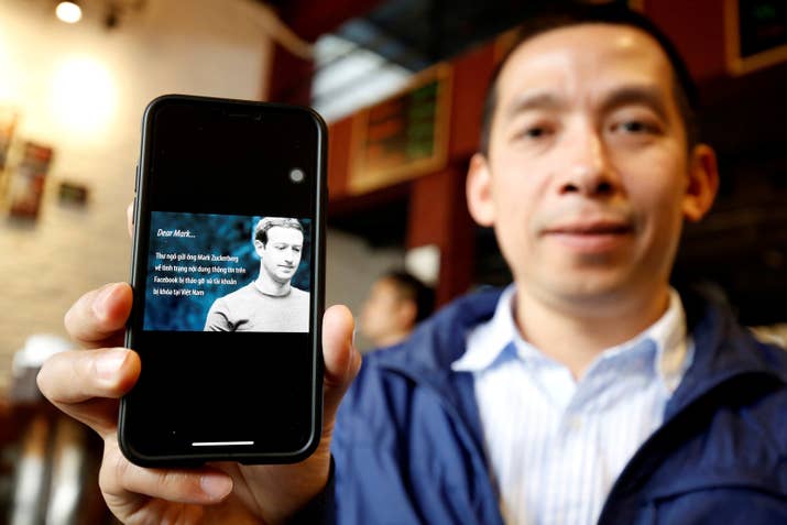 Vietnamese human rights activist, La Viet Dung, shows the open letter signed by himself sent to Mark Zuckerberg.