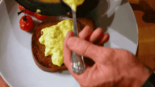 Remove your scrambled eggs from the heat before they're done cooking. The residual heat will continue cooking them.