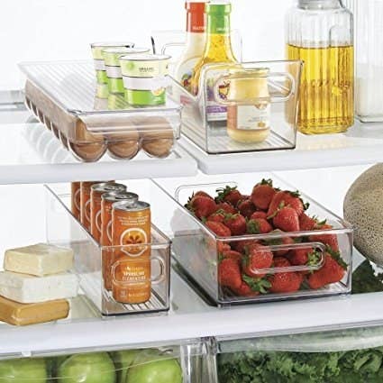 look inside a fridge with clear containers to organize everything in a way so you can see what you have