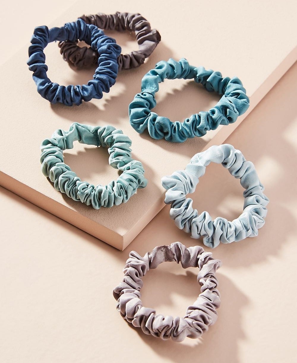 Promising review: "Bought these for the summer — needed some new simple ponytail holders for work, and I love them! They are adorable and get the job done. Tight fit and doesn't pull my hair out. Highly recommended." —YellowcircusGet a six-pack from Anthropologie for $12 (available in three styles).