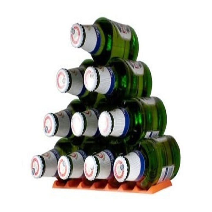 pyramid of beer bottles stacked horizontally on a flat surface with the silicone slatted holder