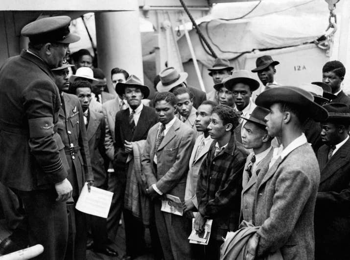 Jamaican immigrants are welcomed by RAF officials from the Colonial Office after the ex-troopship HMT Empire Windrush landed at Tilbury in 1948.