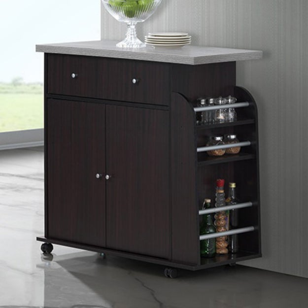 A kitchen cart outfitted with cabinets, a drawer, and a full length spice rack. You'll be doing cartwheels because you got it at such a reasonable price.