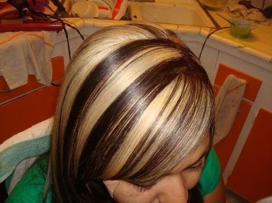 A photo of the top of a woman with chunky highlights head 