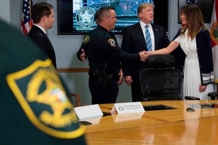 First lady Melania Trump shakes hands with Officer Michael Leonard.