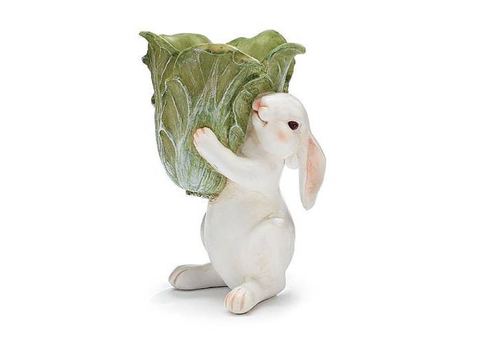 Clutter bins have never been that much adorable before. A sweet little long-eared bunny holding it for you! Just collect all dispersed clutter around your desk and put it into his cabbage urn. Buy it here.