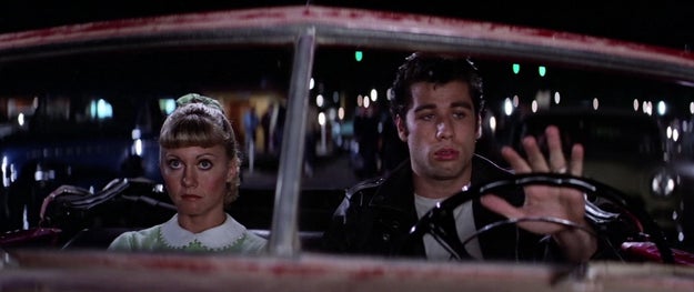 At some point OFF SCREEN, Danny and Sandy talk on the phone and he gives her a half-assed apology and lures her to a drive-in movie...