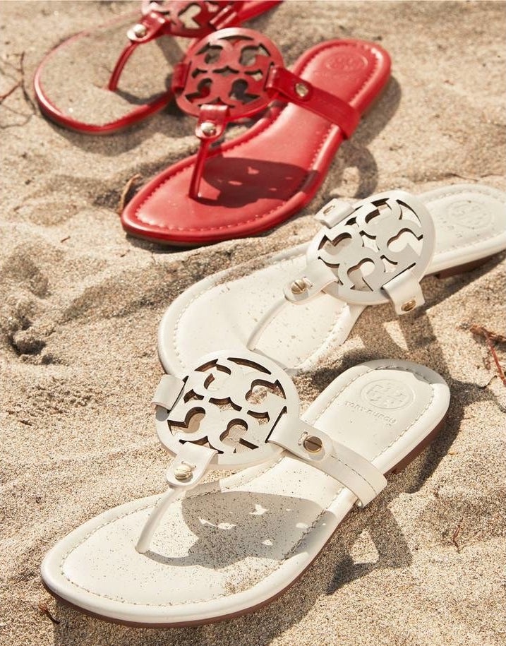 Tory Burch &quot;Miller&quot; flip-flops in a variety of colors.