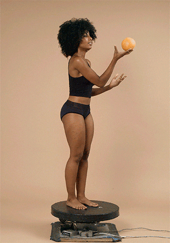 A gif of a model wearing the Hiphugger panties on a rotating platform 