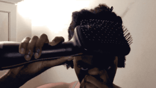 It has four temperature settings, and I used the highest since my hair is so thick and curly. I also spritzed Chi Iron Guard 44 Thermal Protection Spray to each section right before blow drying.