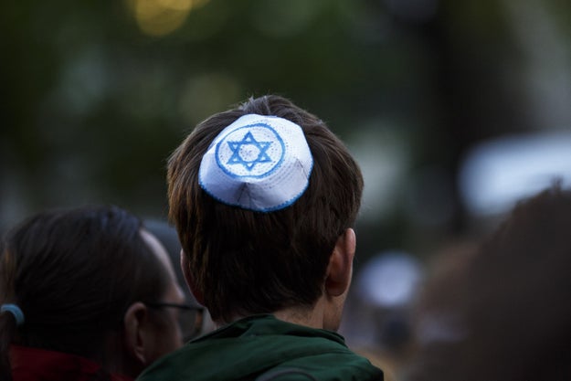 Thousands of Germans lined the streets on Wednesday, donning a vast array of yarmulkes to protest a rise in anti-Semitism in the country.