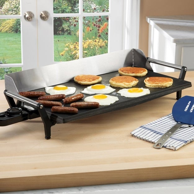 A pro non-stick griddle (with a splatter guard!) that'll be at least half as nice as whatever Ron Swanson owns. (Plenty of room on there for all the bacon and eggs in your fridge.)