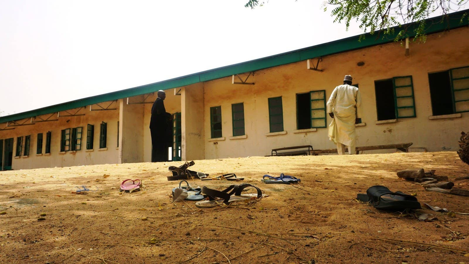 Sandals are strewn in the yard of the Dapchi Girls Science and Technical College staff quarters in the wake of the abduction.