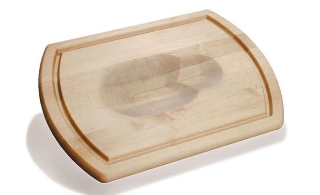 A reversible maple carving board with grooves to catch any juices.