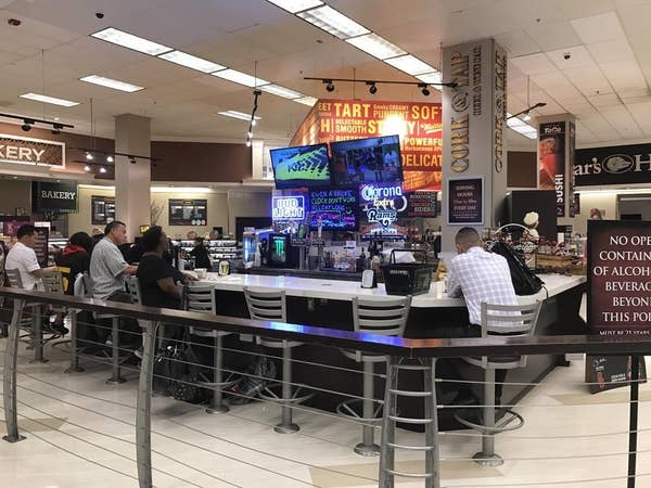 A bar in the middle of a grocery store