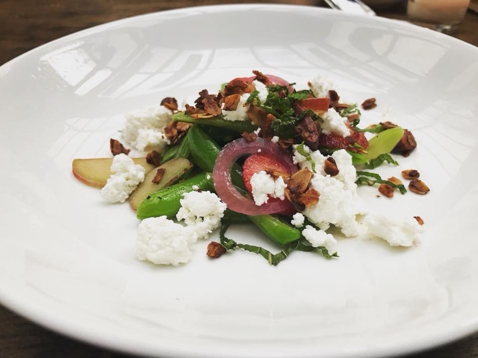 A special on the menu, the Sugar Snap Pea Salad is a beautiful and colorful ensemble of fresh, seasonal ingredients like strawberries, sugar snap pea, pear, almonds, vanilla granola, pickled onion, and sheep milk feta, all tossed in mustard vinaigrette.