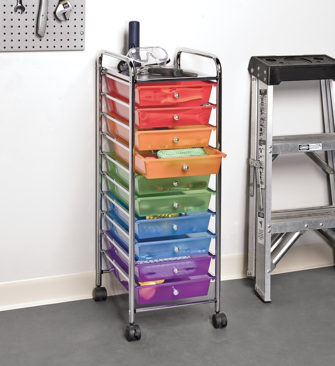 a ten drawer wheely shelf with two drawers in each color of the rainbow except yellow