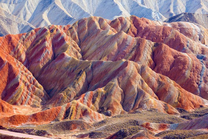 This colorful landscape of rock is mainly in the Kangle and Baiyin townships. The color of the rocks are the result of deposits of sandstone and other minerals.