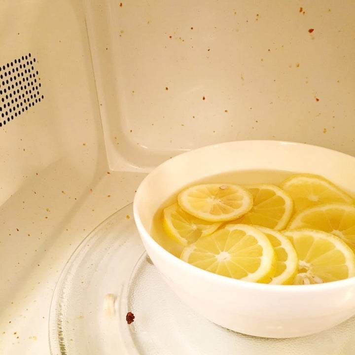 bowl of lemons in water in my dirty microwave