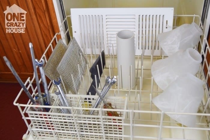 The blogger&#x27;s dishwasher, loaded with all those things plus screw drivers and wrenches in the silverware basket