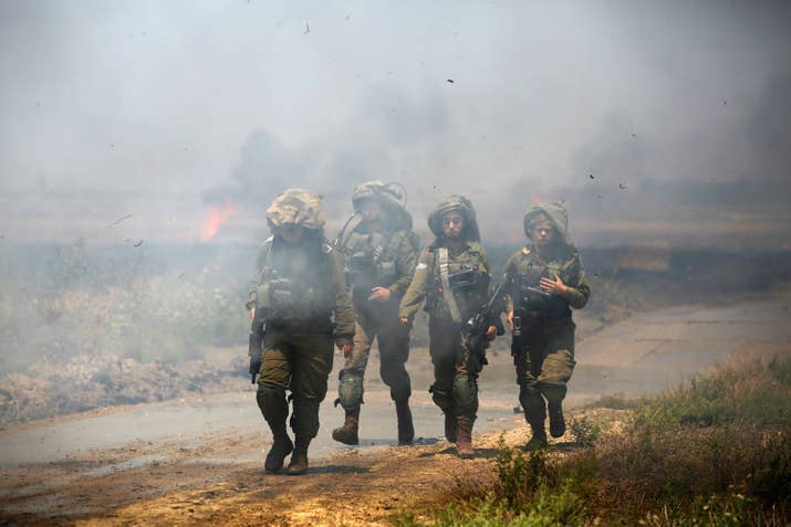 Israeli troops on the Israeli side of the border with Gaza.
