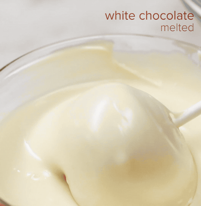 Add enough icing that the cake is moist and holds form. Use an ice cream scoop to make equally-sized balls and roll them in your hands until they're smooth. Dip the skewers in melted white chocolate before spearing the balls so they stay in place. Let them chill in the fridge before dipping them into white chocolate and decorating with sprinkles.