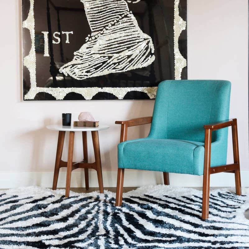 Promising review: "I have been on the hunt for a gorgeous accent chair and was so excited when I saw this one by the Novogratz! They've long been on the top of my list of my favorite designers. I honestly think it looks so much more expensive that it really is. The fabric is high quality and the finish of the wood is beautiful. It's the perfect mid-century accent chair for my bedroom!" —LeighPrice: 9+ (available in two colors)