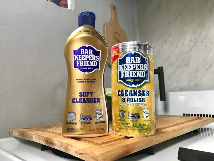 both soft cleanser and powder version bottles on a kitchen stove