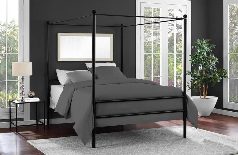 Promising review: "I absolutely love this bed. It's surprisingly stronger than what I thought it would be. I love that it has rods on the base so you can just use the mattress. Otherwise it would be a high climb into bed. But you can still use a boxspring if you want. It is time consuming to put together. But the instructions are easy to follow and understand. Would recommend having two people to put it together, but one could do it by themselves if they had to. Two people makes it easier to hold poles up while bolting into place. Great buy for a good price." —crisPrice: 9+ (available in sizes twin, queen, king and three colors)