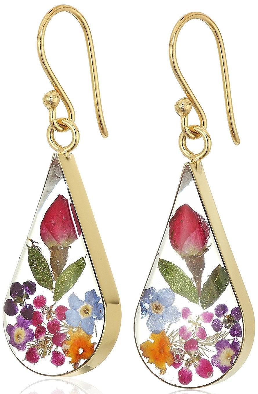 Promising review: "I bought a pair for my wife, upon receiving them I immediately ordered a second pair to give to my mother. They are awesome and both women get compliments on them when they wear them. The flowers look great in there, very very similar to what is pictured. The colors are super versatile and go with a lot of clothing. My wife doesn't wear a ton of dangly earrings (usually just studs) but these are perfectly sized. They aren't super huge and our infant doesn't grab them, which is nice!" —Critical DanPrice: $29+ (available in six colors)
