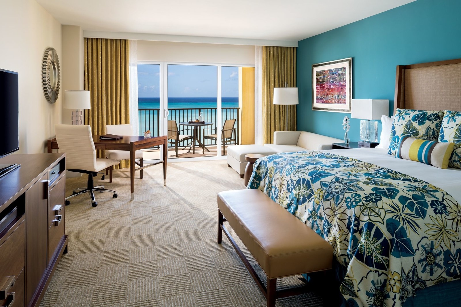You can bask in the beauty of Aruba in your hotel room with private balconies with an unobstructed view of the Caribbean coastline and ocean. The interior features tropical ambience and custom-designed furniture with modern amenities like 46-inch flat-screen TV, iPod docking station, and lavish marble baths.
