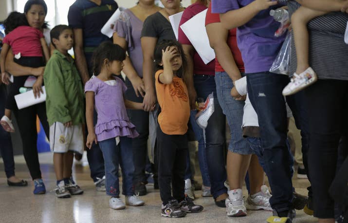 Immigrants stand in line for tickets at a bus station after they are released from a Customs and Border Protection processing facility in Texas.