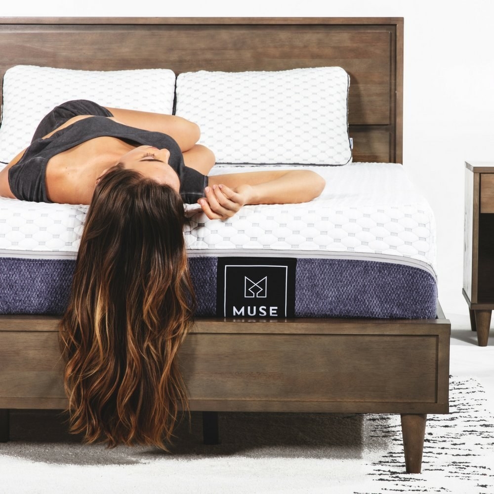 model lays on mattress
